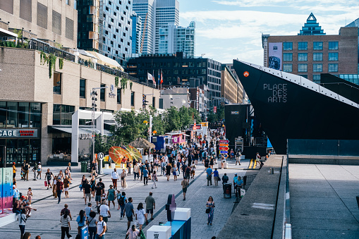 People gather at the  Place des Arts on St-Catherine street for the opening of the Just for Laugh comedy festival in Montréal, Canada.