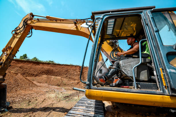 istock Side View Of Worker Showing Expertise In Operating Excavator On Construction Site 1561105108