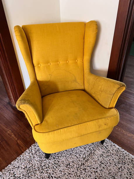 istock Dirty Yellow Chair 1561131743