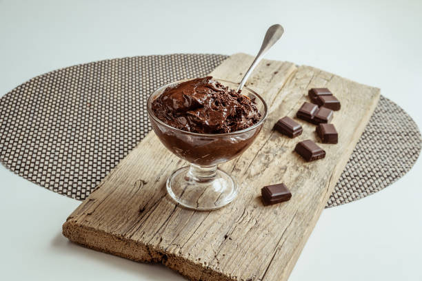 istock Chocolate mousse on a wooden board 1561135018