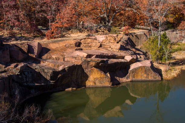 istock Elephant Rocks SP - Flooded Quarry - Granite & Autumn Reflection 1561155378