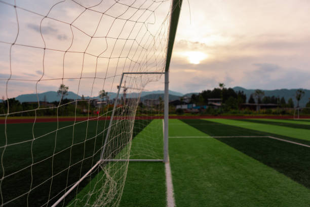 istock Emotional depression, an empty football field at sunset 1561162869