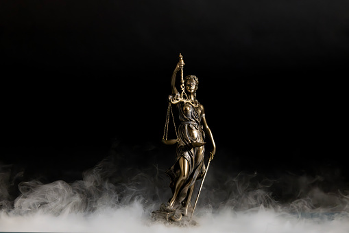 Human rights.Statue of justice on the smoke