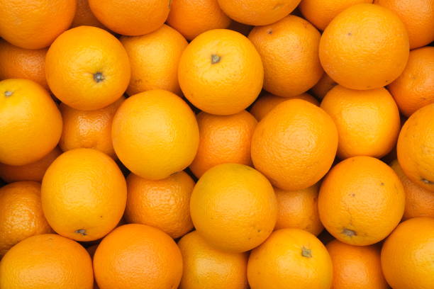 istock Sweet spanish oranges at the market , top down view 1561184232