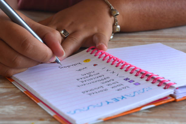 Young woman writing in bullet journal