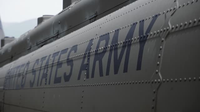 Army marking text on the side of military helicopter