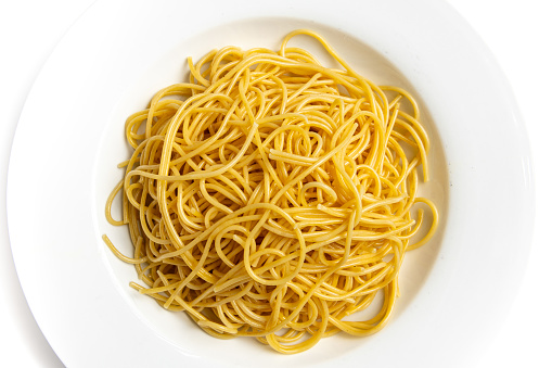 Plain Spaghetti pasta from directly above on white background