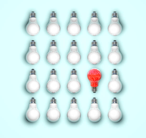 istock Think different concept one red light bulb standing out from the white light bulbs on blue pastel color wall background leadership and individuality creative idea concepts 1561222694