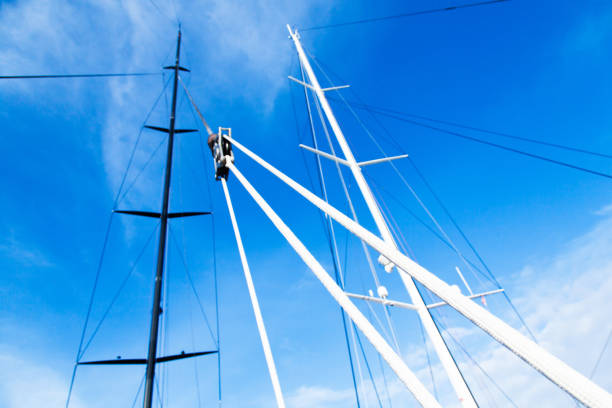 masts of sailing yachts without sails with anchoring ropes. view from below. - repairing sky luxury boat deck imagens e fotografias de stock