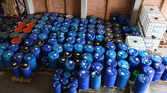 View of a manufacturing chemical plant and a variety of containers in storage