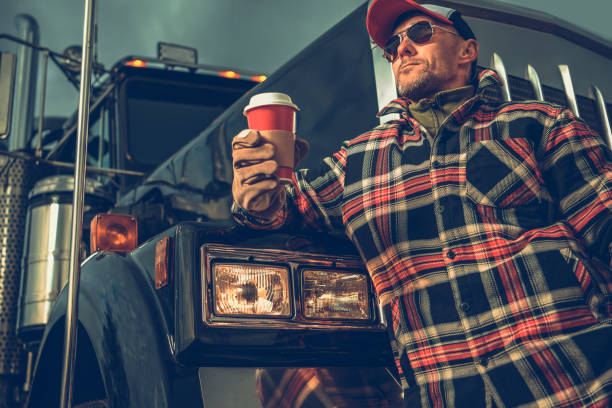 istock American Semi Truck Driver Taking Short Coffee Break 1561326273