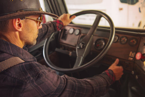 istock Texas Trucker Driving Old Semi Truck 1561329364