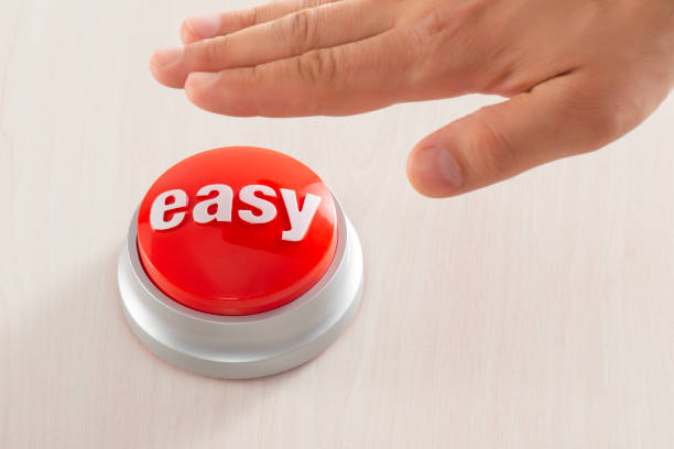 Man Reaching Easy Button Man reaching red easy button. easy button image stock pictures, royalty-free photos & images