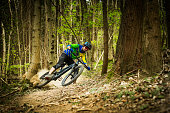 Cross-country downhill rider in the forest