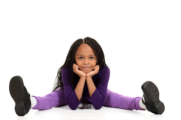 istock Smiling young black girl leaning on elbows 156147252