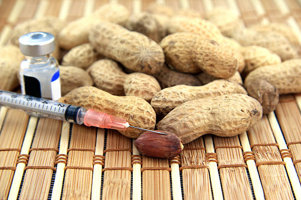 Peanuts with allergy medication stock photo