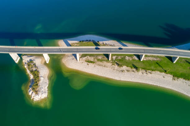 istock Mountain lake with bridge from above 1561473734