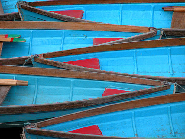 istock stacked blue wooden row boats 156147878