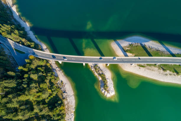 istock Mountain lake with bridge, aerial view 1561486703