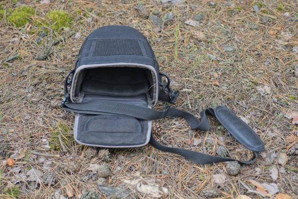 istock one open black bag with a fabric harness lies on the ground 1561493939