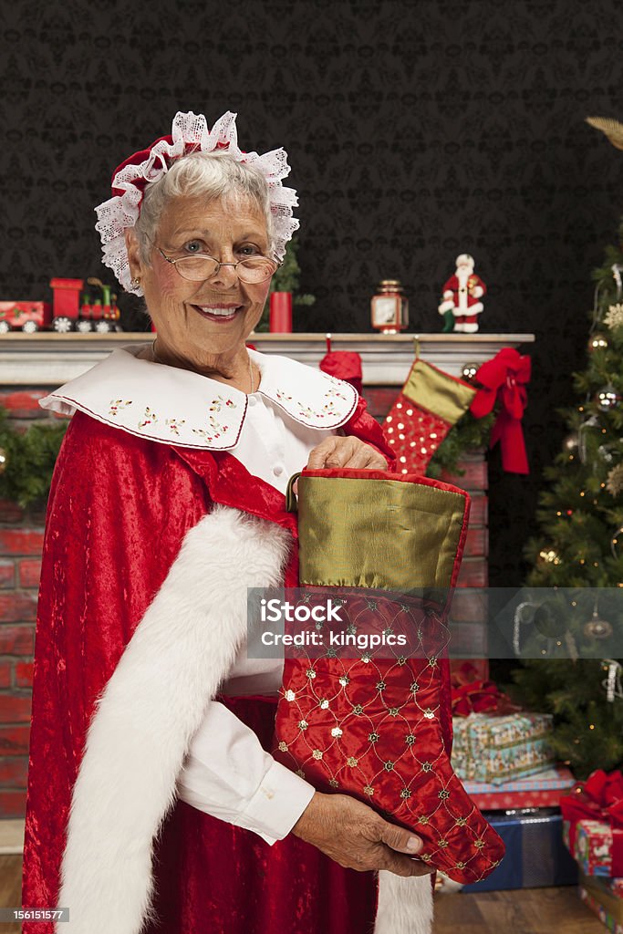 Frau hält eine kleine Claus - Lizenzfrei Farbbild Stock-Foto