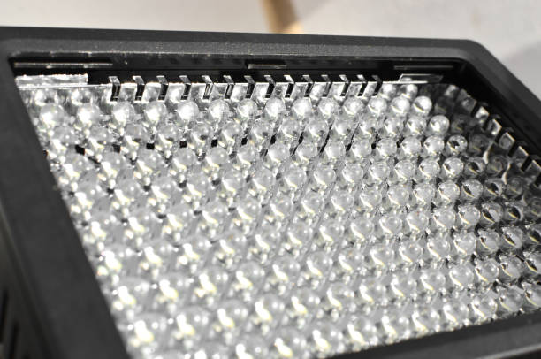 istock Close-up of an LED panel, emphasizing the contrast between the off light bulbs and the dark background, creating an intriguing atmosphere. 1561598812