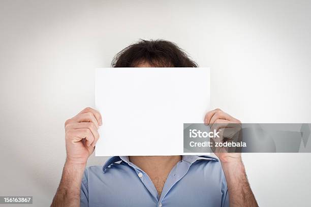 Man Holding A Blank Paper Stock Photo - Download Image Now - Camouflage, Conformity, Adult