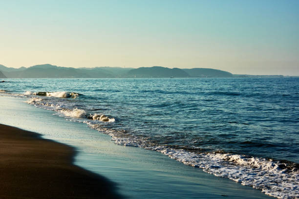 istock Scenic view of beach during sunrise 1561745492