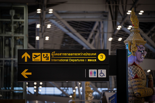 A sign directing passengers to the international departures hall at Suvarnabhumi Airport in Bangkok. International travel at Suvarnabhumi Airport (BKK) in Bangkok, Thiland on July 22, 2023.