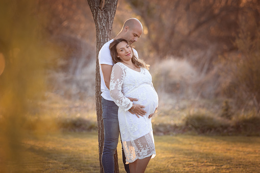 Pregnant woman and her husband outdoors - Buenos Aires - Argentina