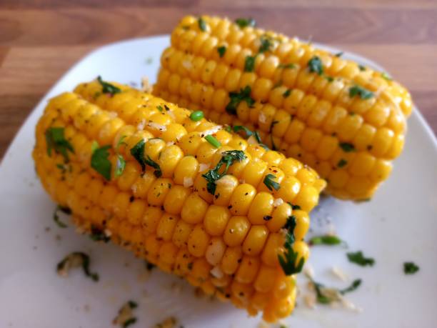 istock Cob of corn with garlic and herbs 1561757966