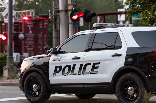Seattle, USA- Jul 3, 2023: A BNSF police car at a train stop on Alaskan Way late in the day.