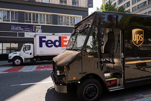 Seattle, USA- Jul 5, 2023: FedEx and UPS in Westlake late in the day.