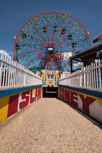 New York, USA - Jun 4, 2019: The Iconic Coney Island tunnel leading from the beach to the famous Wonder Wheel late in the day.