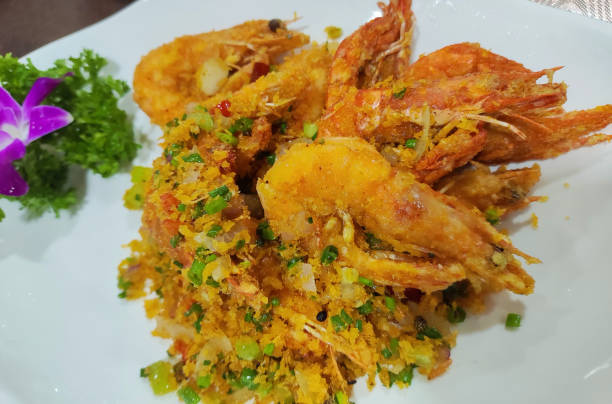 fresh fried shrimp with pepper on the plate ready for eating