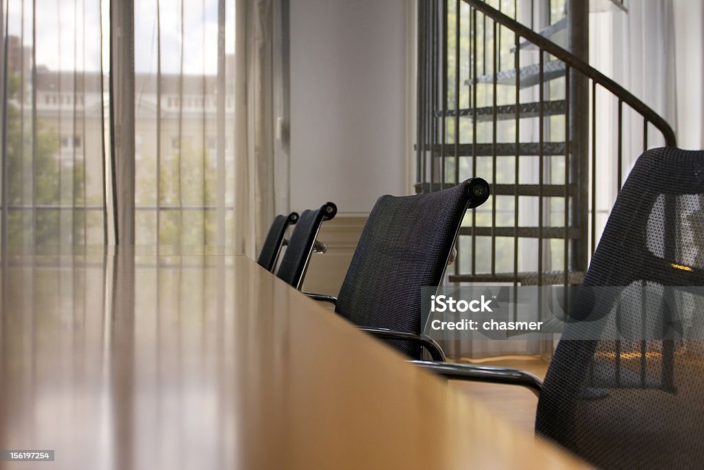 Small office Indoor shot of small office with spiral stairs on background Black Color Stock Photo