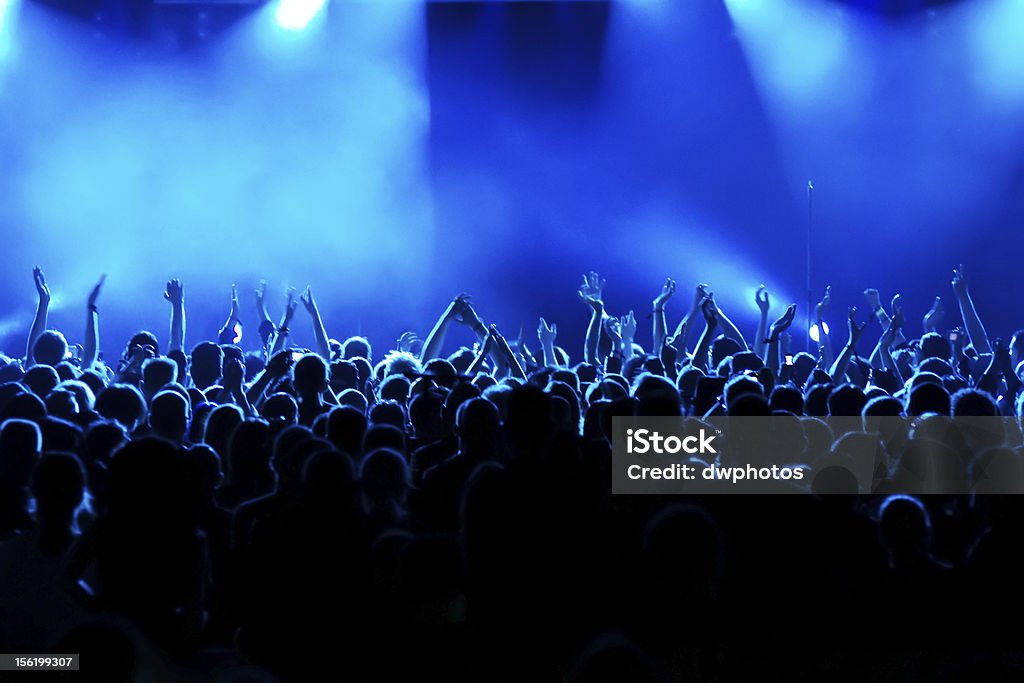 Long time exposure at concert Long time exposure at concert / motion blur of clapping people Applauding Stock Photo