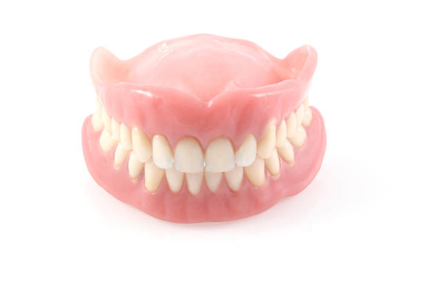 istock A set of clean white and pink dentures 156200251