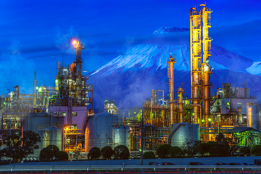 Oil refinery factory in Japan with Fuji mountain background on Night time