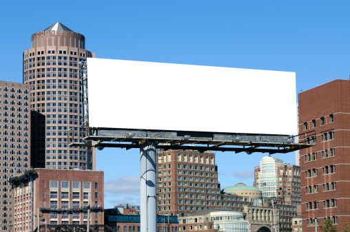 Large billboard in the city. Outdoor advertising with urban background