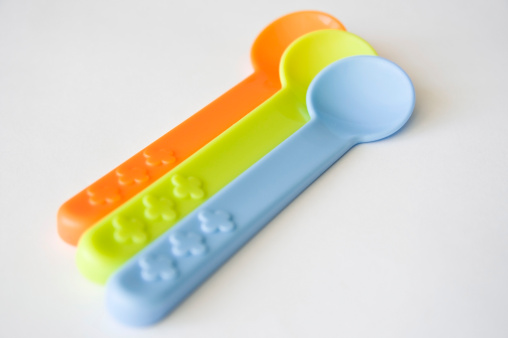 3 coloured baby spoons