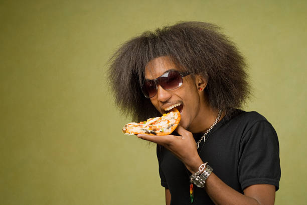 istock Young African American Enjoying a Pizza 156202689