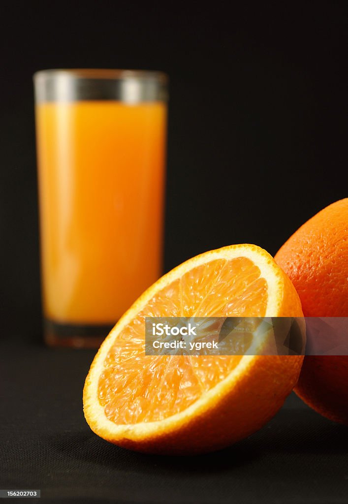 Orange juice Perfect juicy oranges and glass with juice. Backgrounds Stock Photo