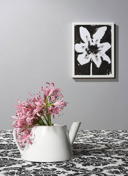 Tea pot used as vase stock photo