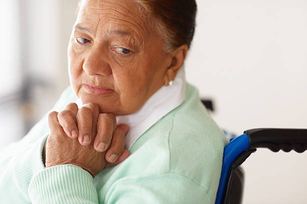istock Depressed elderly woman on a wheelchair 156205231