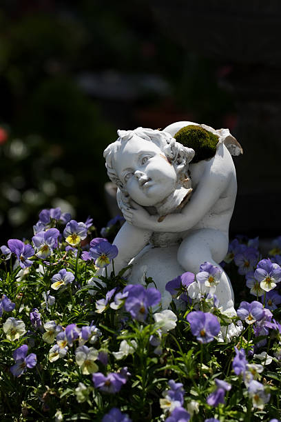 istock Headless Garden Statue holding its own head 156205445