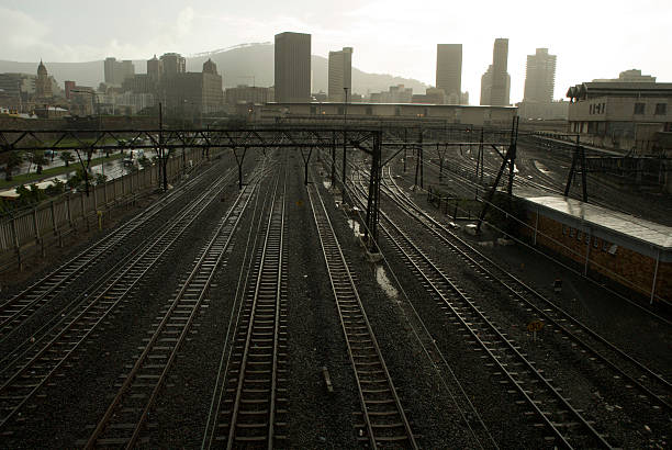 Train tracks lead to the city centre. stock photo