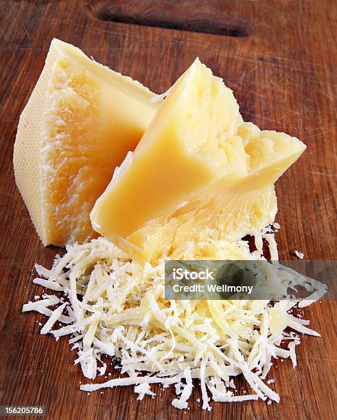 Parmesan Cheese In Block And Grated Forms Stock Photo - Download Image Now - Broken, Cheese, Cracked