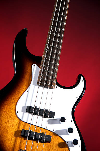 istock Bass Guitar Isolated Sunburst on Red 156206359