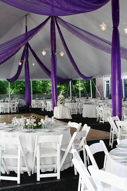 istock Wedding reception with purple bows and white tables 156206780